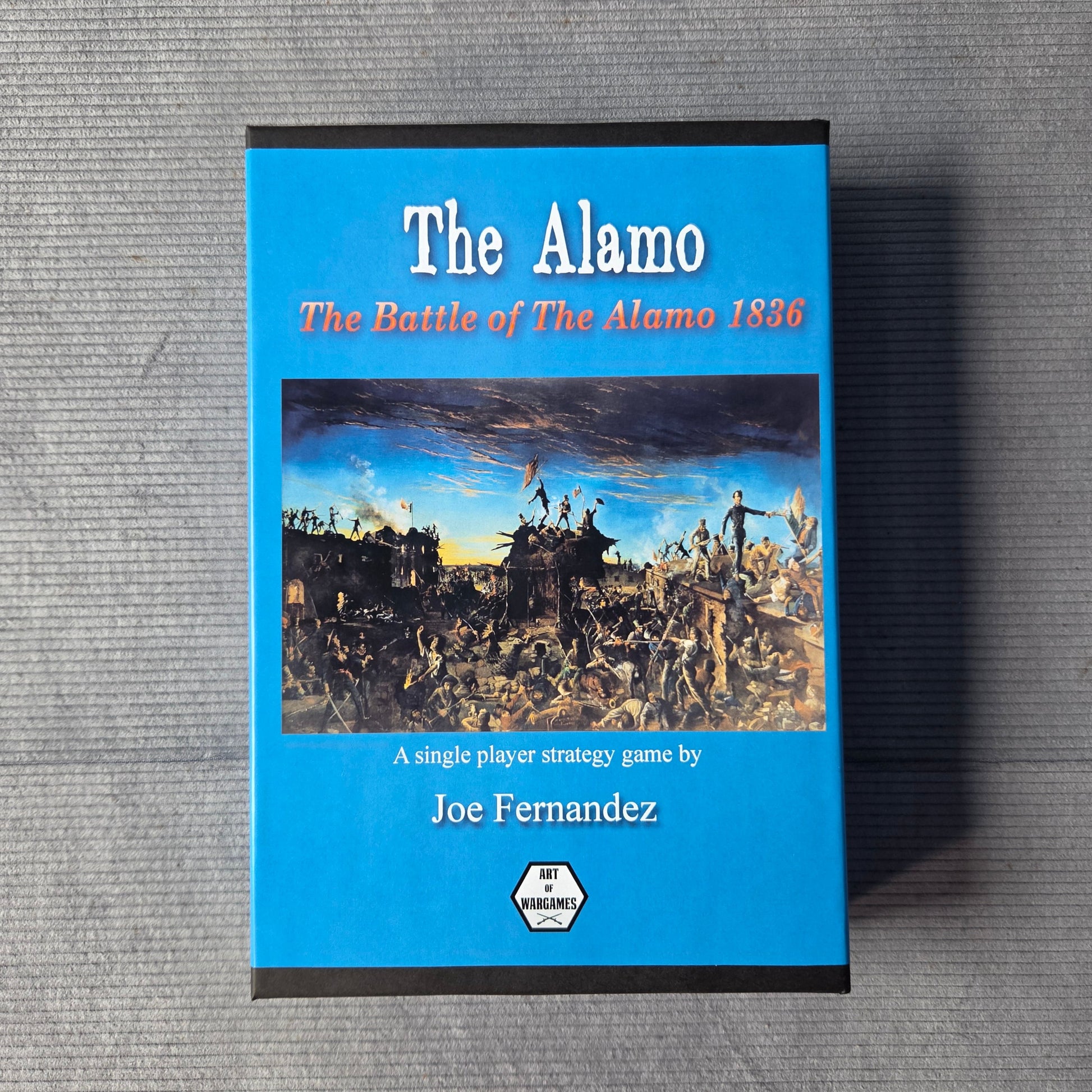 Game titled 'The Alamo' on a gray surface